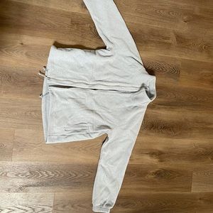 100% polyester, light grey/silver. Lightly worn